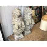 A pair of moulded composition stone heraldic style rampant lion figures holding shields (h.74cm x