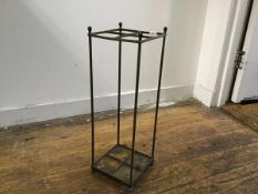 An Edwardian cast brass four section upright open stick stand, on cast iron base (h.54cm x 18cm x