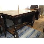 A reproduction refectory style panel top draw leaf table, the plank top with moulded edge above pull