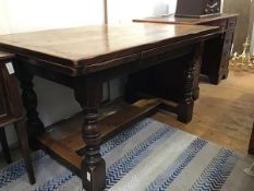 A reproduction refectory style panel top draw leaf table, the plank top with moulded edge above pull