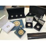 A two pound proof coin, two one pound Last Round coins, a silver one pound coin, a set of three