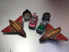 Two Girojex model tinplate airplanes (missing wheels) and two novelty tinplate cars, a Vacuum