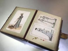 A Victorian photograph album with pasted in Regency and Victorian costume bookplates, with music box