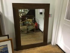 A walnut framed modern bevelled glass wall mirror (h.122cm x 91cm)