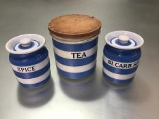 A Cornish ware blue and white miniature spice jar and bicarbonate of soda jar, complete with tops (