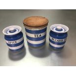 A Cornish ware blue and white miniature spice jar and bicarbonate of soda jar, complete with tops (