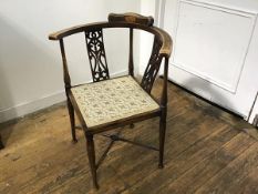 An Edwardian mahogany inlaid corner chair with pierced splat, with inset seat on turned tapered