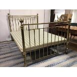 A Victorian brass bedstead with circular brass knobs on end column posts (h.130cm x 150cm x 116cm)