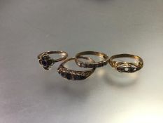 An 18ct gold part gem set ring, (missing stones and losses), a 9ct gold amethyst ring, a 9ct gold