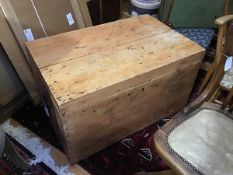 A 19thc stripped pine kist, the rectangular hinged top with moulded edge above a plain interior,
