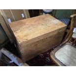 A 19thc stripped pine kist, the rectangular hinged top with moulded edge above a plain interior,