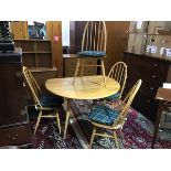 An Ercol light ash five piece kitchen/dining set comprising hoop back and spar back chairs and