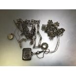 A silver engraved vesta case, a white metal watch albert, a paste set brooch, watch key etc., and