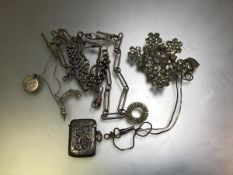 A silver engraved vesta case, a white metal watch albert, a paste set brooch, watch key etc., and