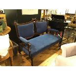 An Edwardian mahogany framed two seater drawing room settee with pierced centre splat, with