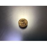 A Victorian gold sovereign dated 1895