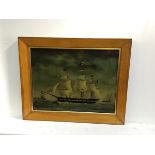 A reproduction bird's eye maple framed reverse painting on glass of a Three Masted US Clipper (