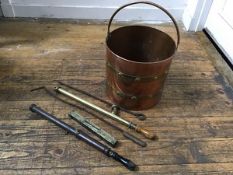 A copper brass bound coal pail with loop handle to top (h.28cm x 30cm), two pokers, two garden