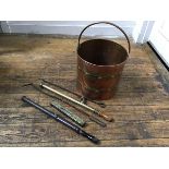 A copper brass bound coal pail with loop handle to top (h.28cm x 30cm), two pokers, two garden