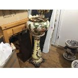 A Victorian jardiniere on associated stand with painted vingnettes, raised on scroll feet (