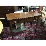 A 19thc mahogany breakfront side table, with crossbanded top, fitted centre frieze drawer, flanked