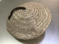 Christian Dior Essence Chapeaux, a 1950s cream raffia beret with stitched brown grosgrain detail