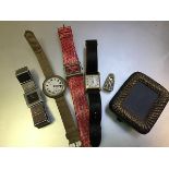 A mixed lot comprising a lady's Gucci stainless steel square faced wristwatch, a gentleman's white