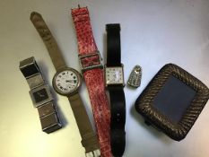 A mixed lot comprising a lady's Gucci stainless steel square faced wristwatch, a gentleman's white