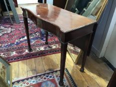 A 19thc mahogany drop leaf side table, the serpentine top with beaded border on square tapered