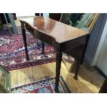 A 19thc mahogany drop leaf side table, the serpentine top with beaded border on square tapered