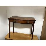 A 19thc serpentine side table fitted single frieze drawer on square tapered inlaid supports (losses)
