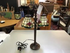 A modern anodised bronze finish centre column Tiffany style lamp with twin floral style leaded glass