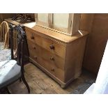 A Victorian stripped pine chest, the rectangular top with rounded angles above two short and two