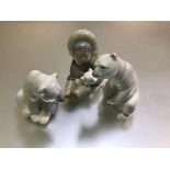 Two Lladro Spanish porcelain Polar Bear figures (tallest: 11cm shortest: 8cm) and an Eskimo Girl