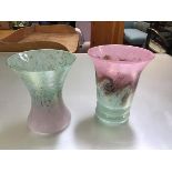 Two cased glass pink to green and green to pink swirling tapered vases, one with ribbed base,