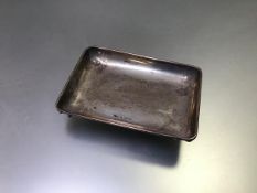 A Birmingham silver rectangular pin tray raised on pad feet (h.2cm x 10cm x 7cm) (47.57g)