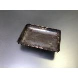 A Birmingham silver rectangular pin tray raised on pad feet (h.2cm x 10cm x 7cm) (47.57g)