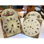 A 19thc painted arched dial longcase clock face and movement with roman numerals and a 19thc painted