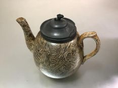 A Victorian gold lustre pottery teapot with pewter mounted hinged top (a/f), decorated with stylised