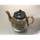 A Victorian gold lustre pottery teapot with pewter mounted hinged top (a/f), decorated with stylised