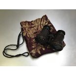 A Victorian velveteen embroidered bag with fern and leaf decoration (17cm x 14cm) and a pair of