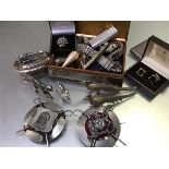 A white metal cigarette box, miscellaneous sleevelinks, a pair of white metal pheasant table