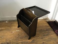 A 1920s/30s plywood magazine rack with lift up fold out table panel back (41cm x 18cm x 41cm)