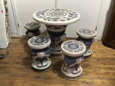 A modern frostproof stoneware five piece garden set, the circular topped table with stylised lotus