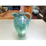 A 1930s turquoise and lapis blue decorated baluster jug with wavy top (slight chip to base) (h.
