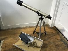 A Tasco 60mm x 800mm coated telescope complete with stand and accessories