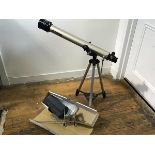 A Tasco 60mm x 800mm coated telescope complete with stand and accessories