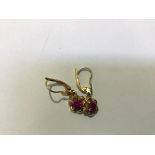 A pair of Indian 18ct gold floral drop earrings set pink stones (drop: 2.5cm)