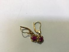 A pair of Indian 18ct gold floral drop earrings set pink stones (drop: 2.5cm)