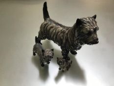 A Royal Doulton Cairn Terrier Grand Champion Charming Eyes, HN1033 and a smaller version, and a